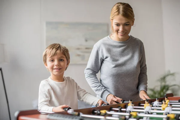 Mother and son playing table football — Stock Photo