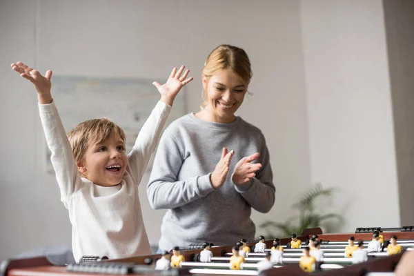 Mother and son playing table football — Stock Photo