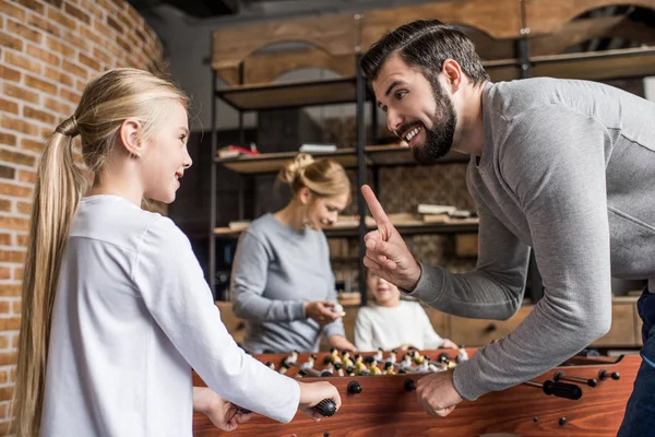 Family playing table football — Stock Photo