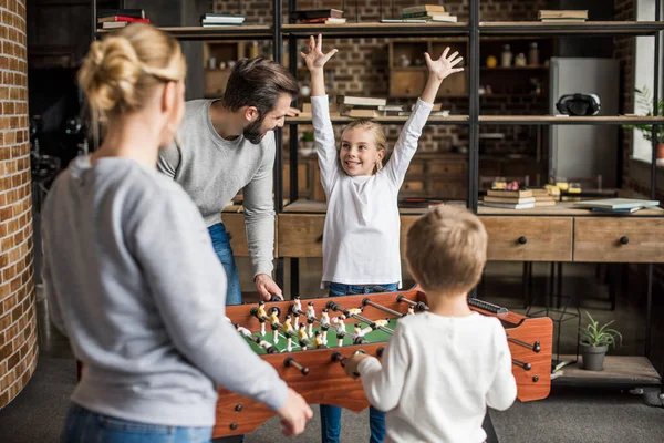 Family playing table football — Stock Photo