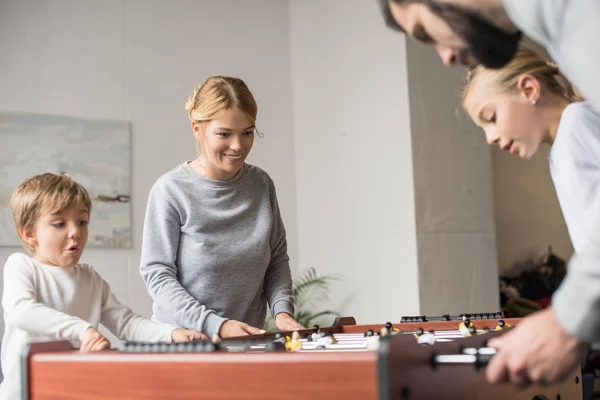 Family playing table football together — Stock Photo