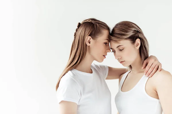 Woman hugging girlfriend — Stock Photo