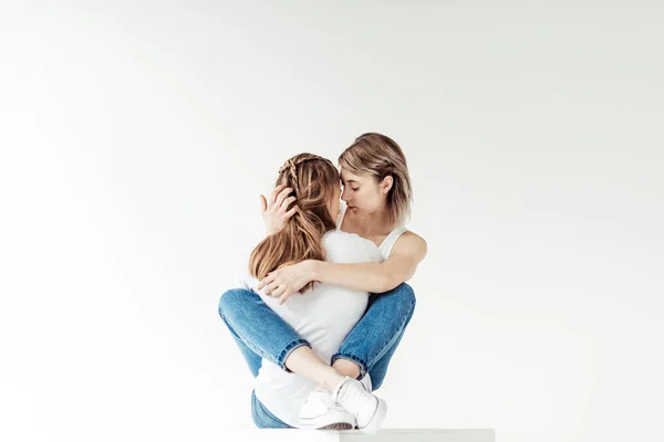 Girlfriends hugging each other — Stock Photo