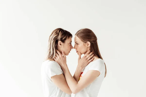 Women hugging and standing face to face — Stock Photo