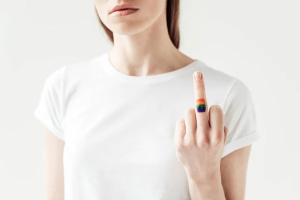 Middle finger with painted rainbow flag — Stock Photo