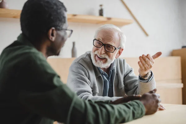 Senior friends having discussion — Stock Photo