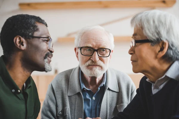 Senior friends playing staring contest — Stock Photo