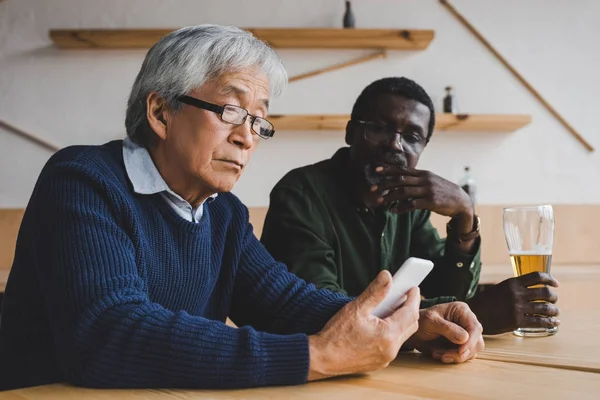 Depressed senior men sitting in bar — Stock Photo