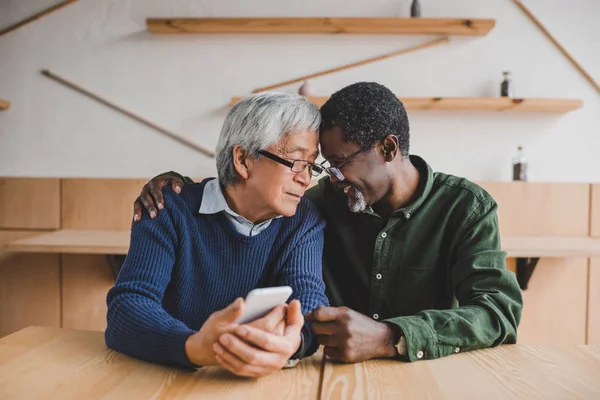 Senior men embracing — Stock Photo