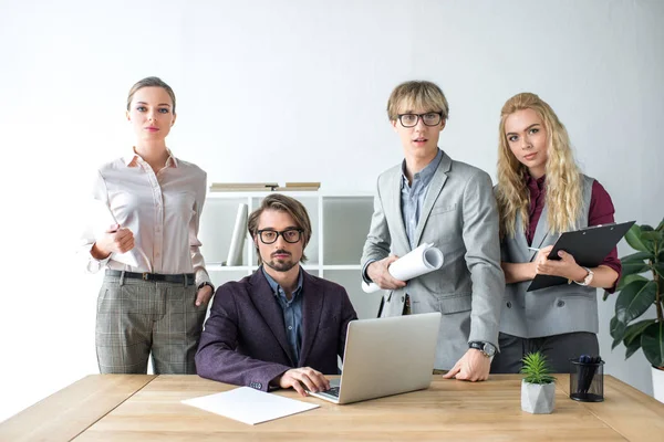 Young businesspeople in office — Stock Photo