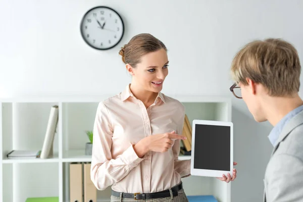 Woman pointing on something on tablet — Stock Photo