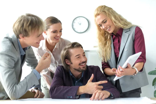 Business partners looking at tablet — Stock Photo