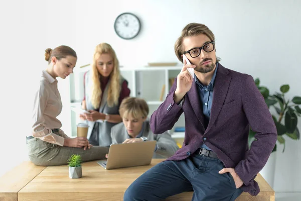 Team leader talking by smartphone — Stock Photo