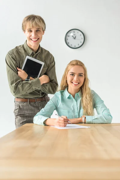Smiling colleagues in the office — Stock Photo