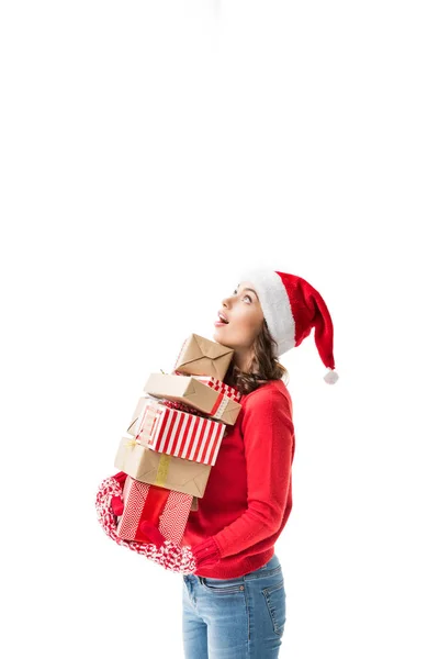 Woman holding stack of christmas gifts — Stock Photo
