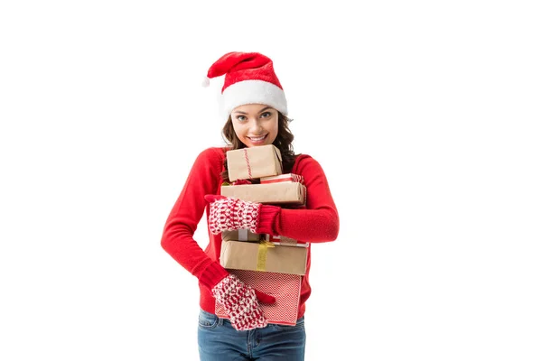 Woman holding stack of christmas gifts — Stock Photo