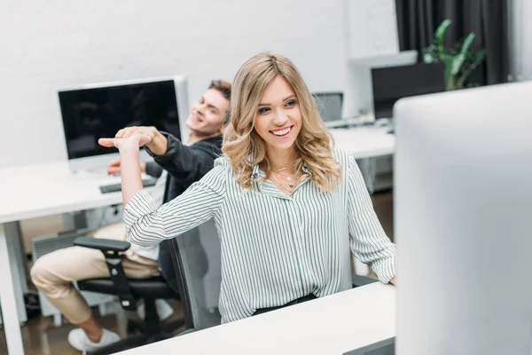 Business partners giving high five at modern open space office — Stock Photo