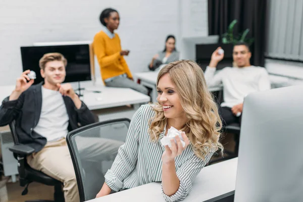 Young multiethnic business partners having fun at office — Stock Photo