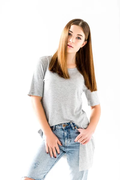 Portrait of pensive young woman in stylish clothing looking at camera,  isolated on white — Stock Photo