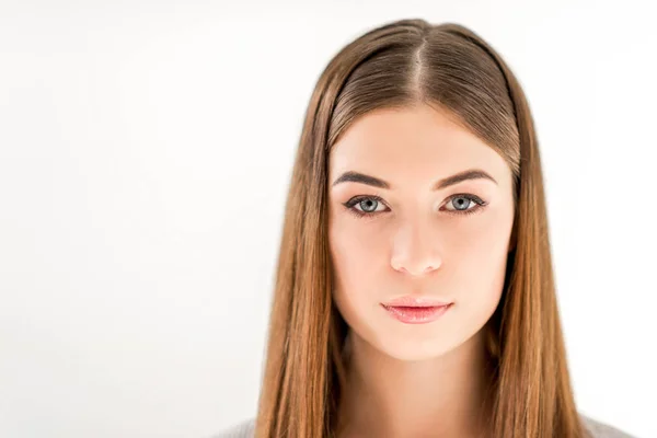 Headshot of beautiful young woman with straight hair looking at camera isolated on white — Stock Photo
