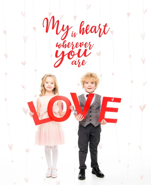 Kids holding word love — Stock Photo