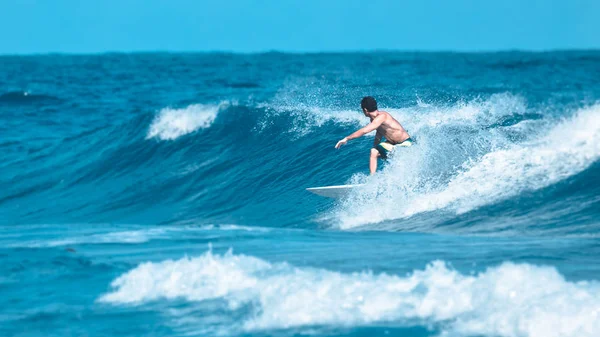 Surfer rides a wave peak, film effect, 30.12.2016 — Stock Photo, Image