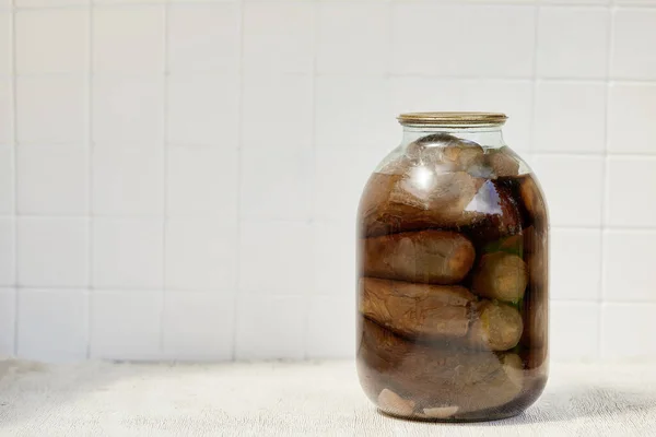 Pickled eggplant, pickled vegetables in a jar, Close up on a white background