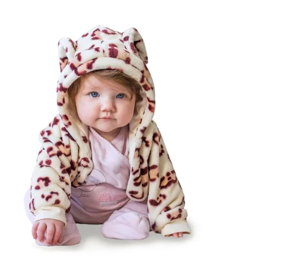 Baby sitting and smiling in a camouflage costume on a white background. Isolate. — Stock Photo, Image