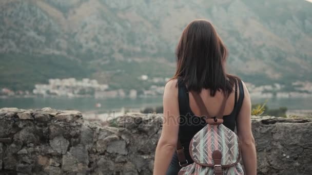 Outdoor Lifestyle Portrait of Young Woman Walking Down The Street At Old Town, Travel With Backpack, Stylish Casual Outfit, Evening Sunset — Stock Video