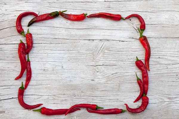 Quadro Com Pimenta Quente Fundo Madeira — Fotografia de Stock