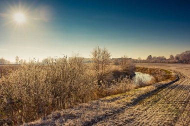 beautiful winter landscape in East Frisia, Germany clipart