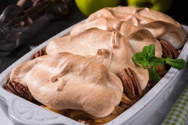 Baked apples with nuts and meringue — Stock Photo, Image