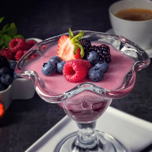 Delicious pudding with berries — Stock Photo, Image