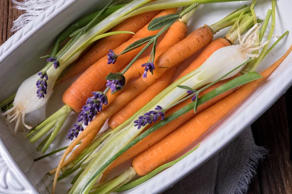 Carrots and spring onions — Stock Photo, Image