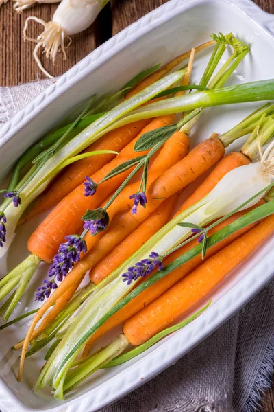 Carrots and spring onions — Stock Photo, Image