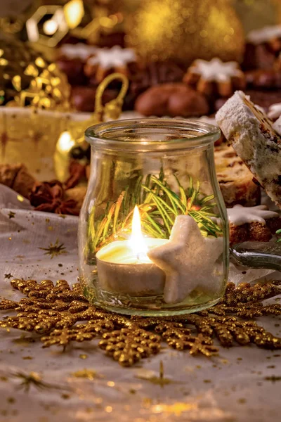 Glass jar with candle and Christmas decoration — Stock Photo, Image