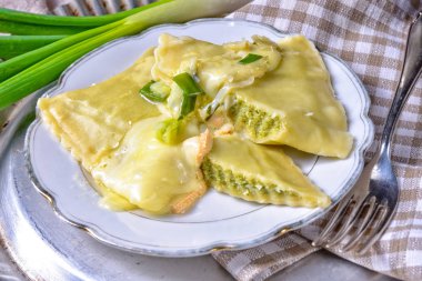 delicious ravioli gratinated with cheese, Swabian cuisine clipart