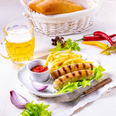 grilled bratwurst with chips and cold beer clipart