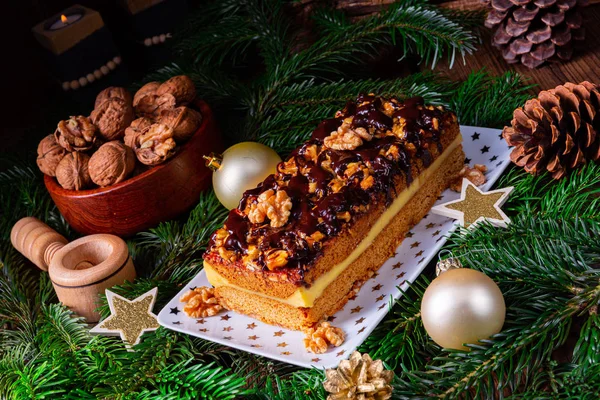 Chocolate gingerbread with filling, jam and nuts — Stock Photo, Image