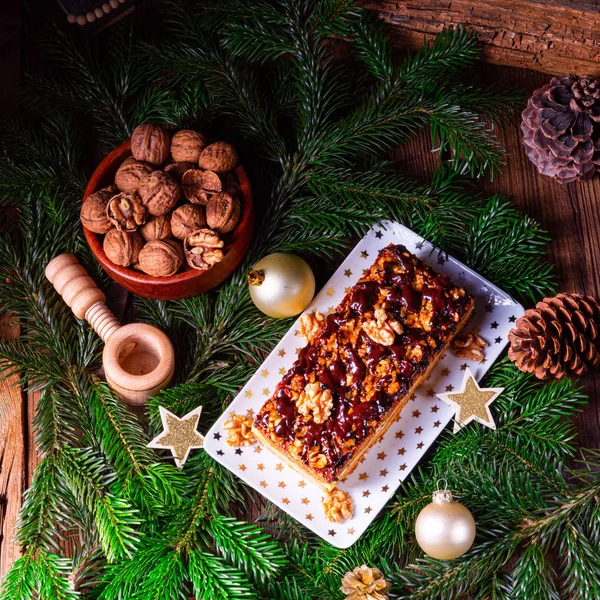 Chocolate gingerbread with filling, jam and nuts — Stock Photo, Image