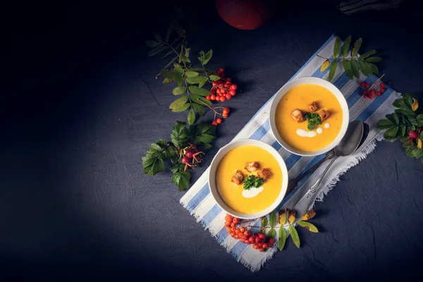 Delicious pumpkin soup with croutons and coconut milk — Stock Image Delicious pumpkin soup with croutons and coconut milk Stock Photo
