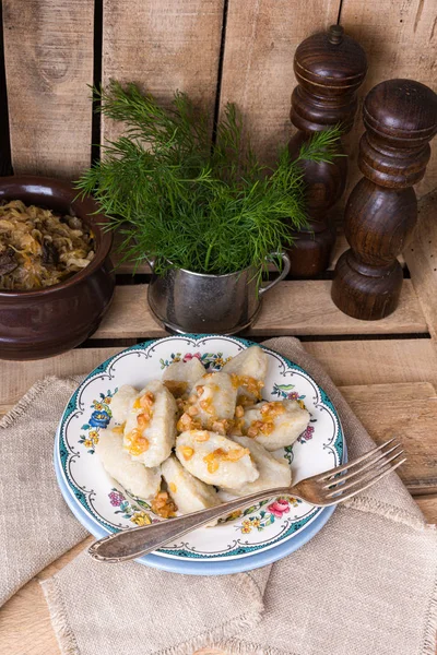 Szare kluski, Polish dumplings with sauerkraut — Stock Photo, Image
