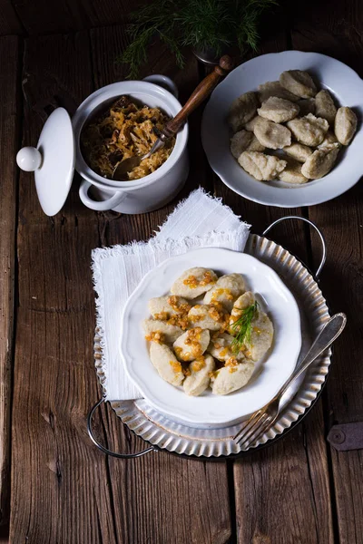 Szare kluski, Polish dumplings with sauerkraut — Stock Photo, Image