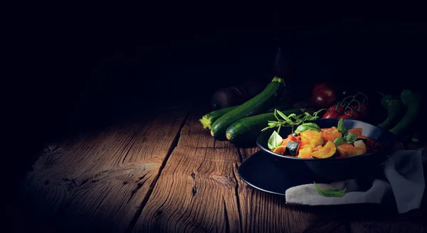 Zucchini vegetarian ratatouille with tomato sauce and herbs — Stock Photo, Image