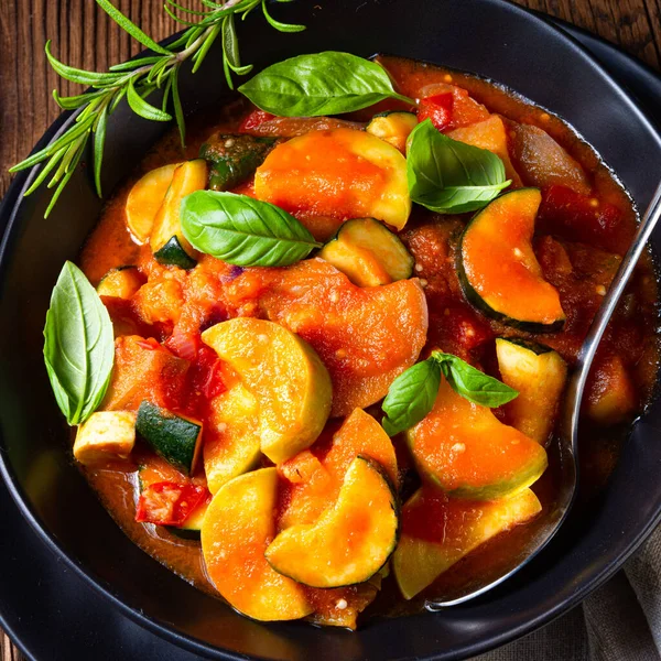 Zucchini vegetarian ratatouille with tomato sauce and herbs — Stock Photo, Image