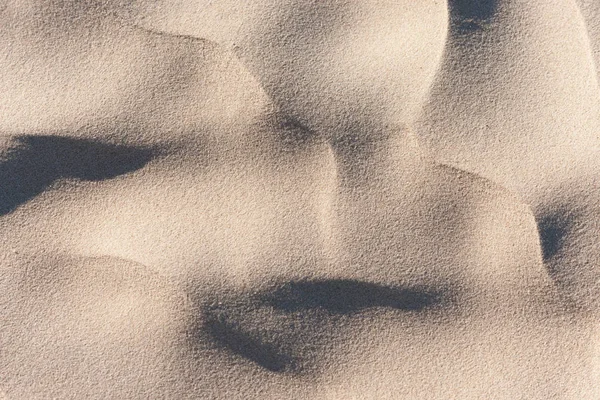 Тень на песке — стоковое фото
