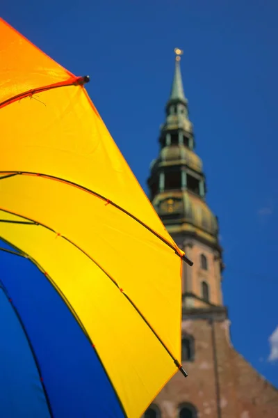 Yellow umbrella in the old town — Stock Photo, Image