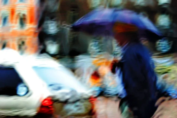 Pedestrian under the umbrella in the rain — Stock Photo, Image