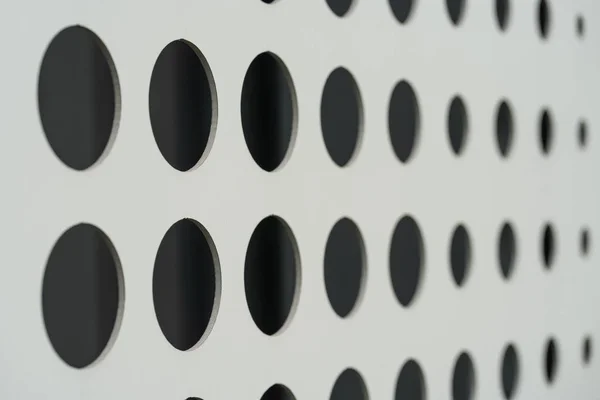 White wall with drilled holes — Stockfoto