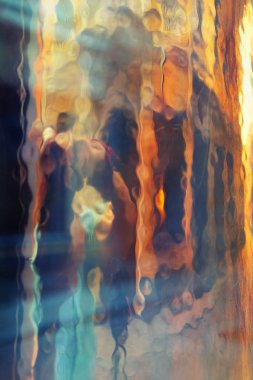 Abstract reflection in glass with deformations.